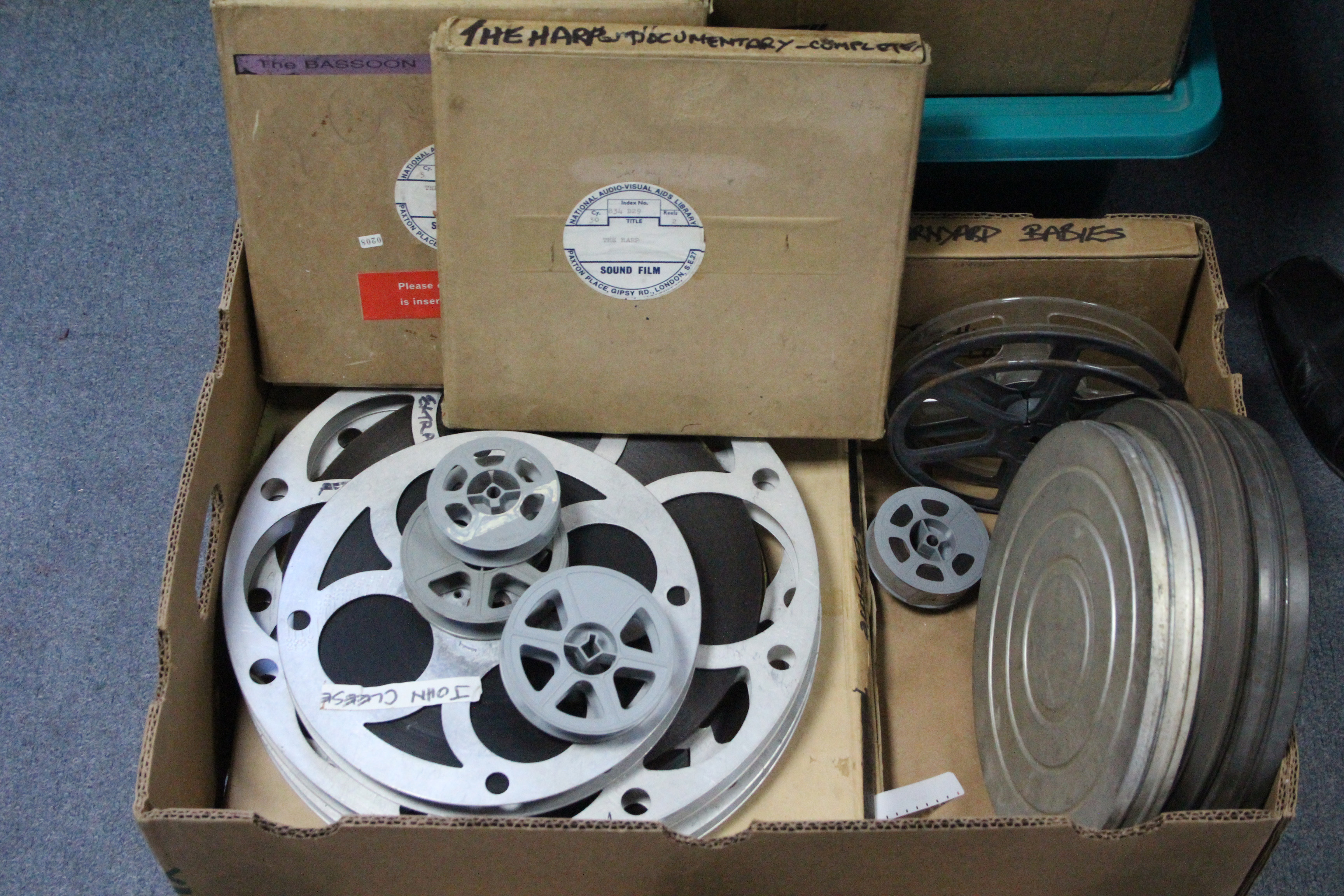 A collection of 16mm film reels; a film projector; & a film editor. - Image 5 of 11