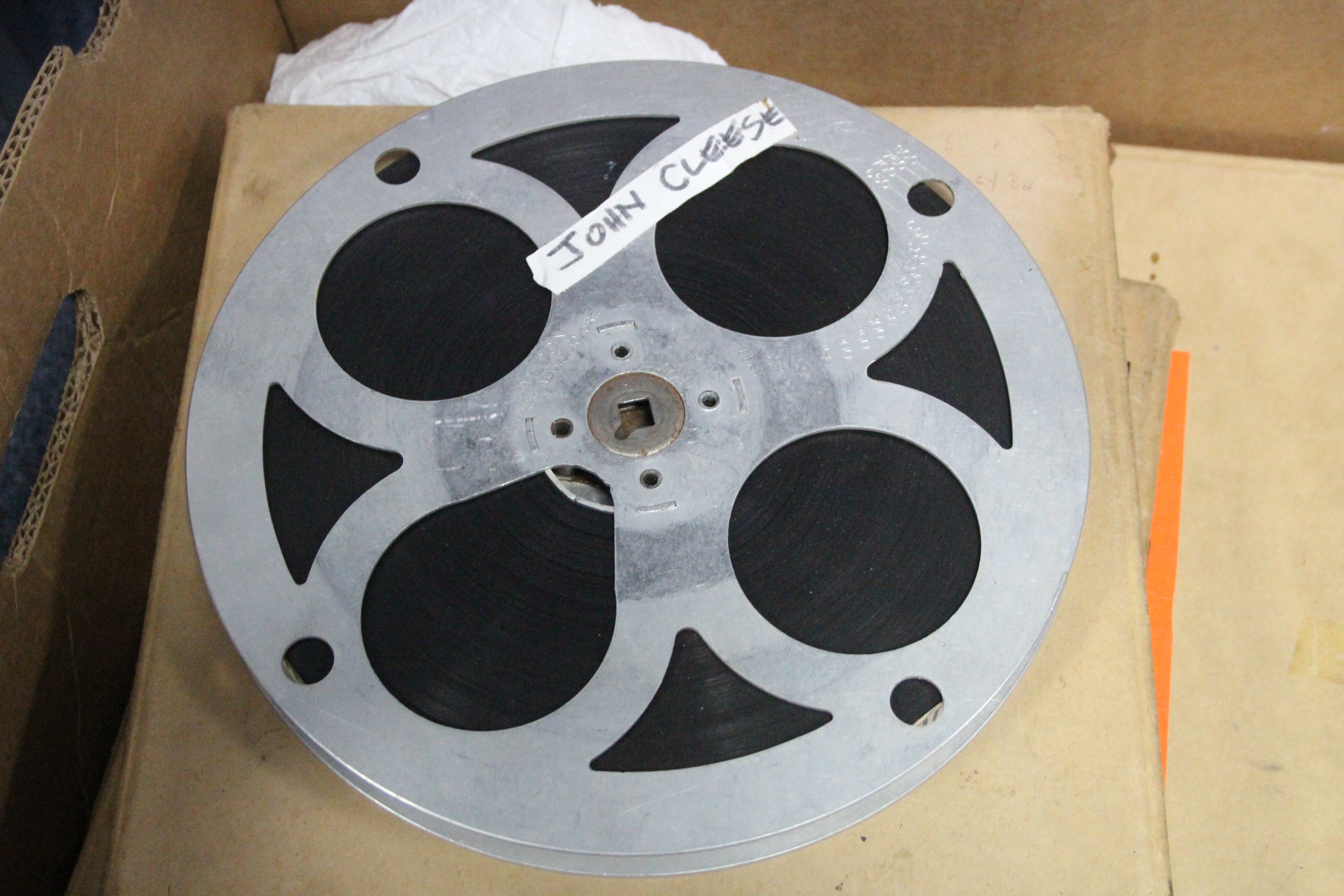 A collection of 16mm film reels; a film projector; & a film editor. - Image 6 of 11