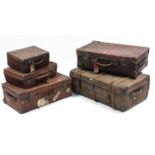 Five various vintage travelling trunks & suitcases, part w.a.f.