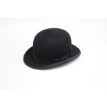 A Dulcis black felt bowler hat, (size 6?) & an Edwardian black ladies’ cape.