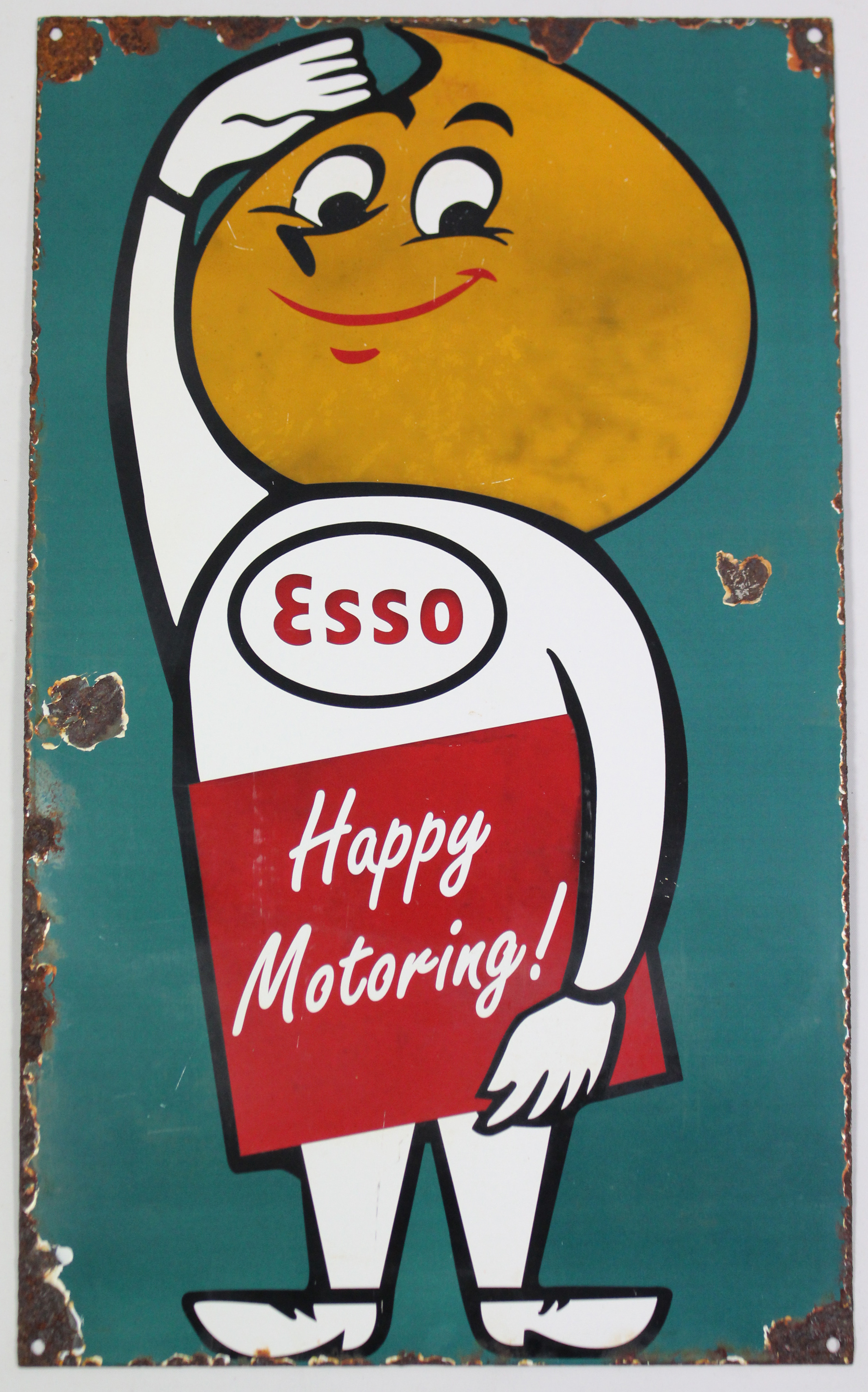 AN ANTIQUE ENAMELLED RECTANGULAR SIGN “ESSO HAPPY MOTORING!”, 19¾” x 11¾”.