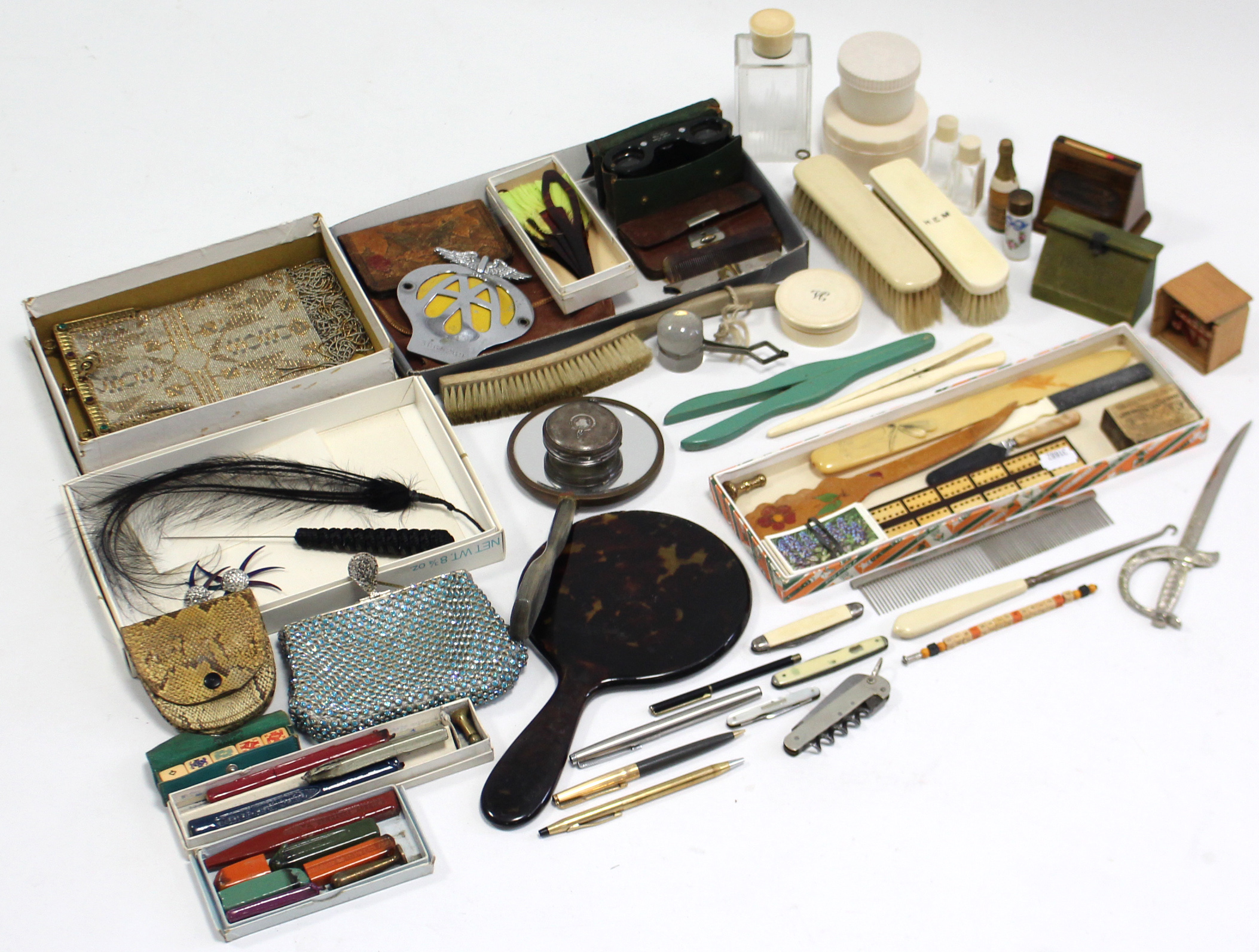 Three ball-point pens; an “AA” car membership badge; a pair of opera glasses; & sundry other items.