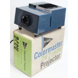 A Boots “Colormaster” 2 x 2 slide projector, boxed; together with various slides.