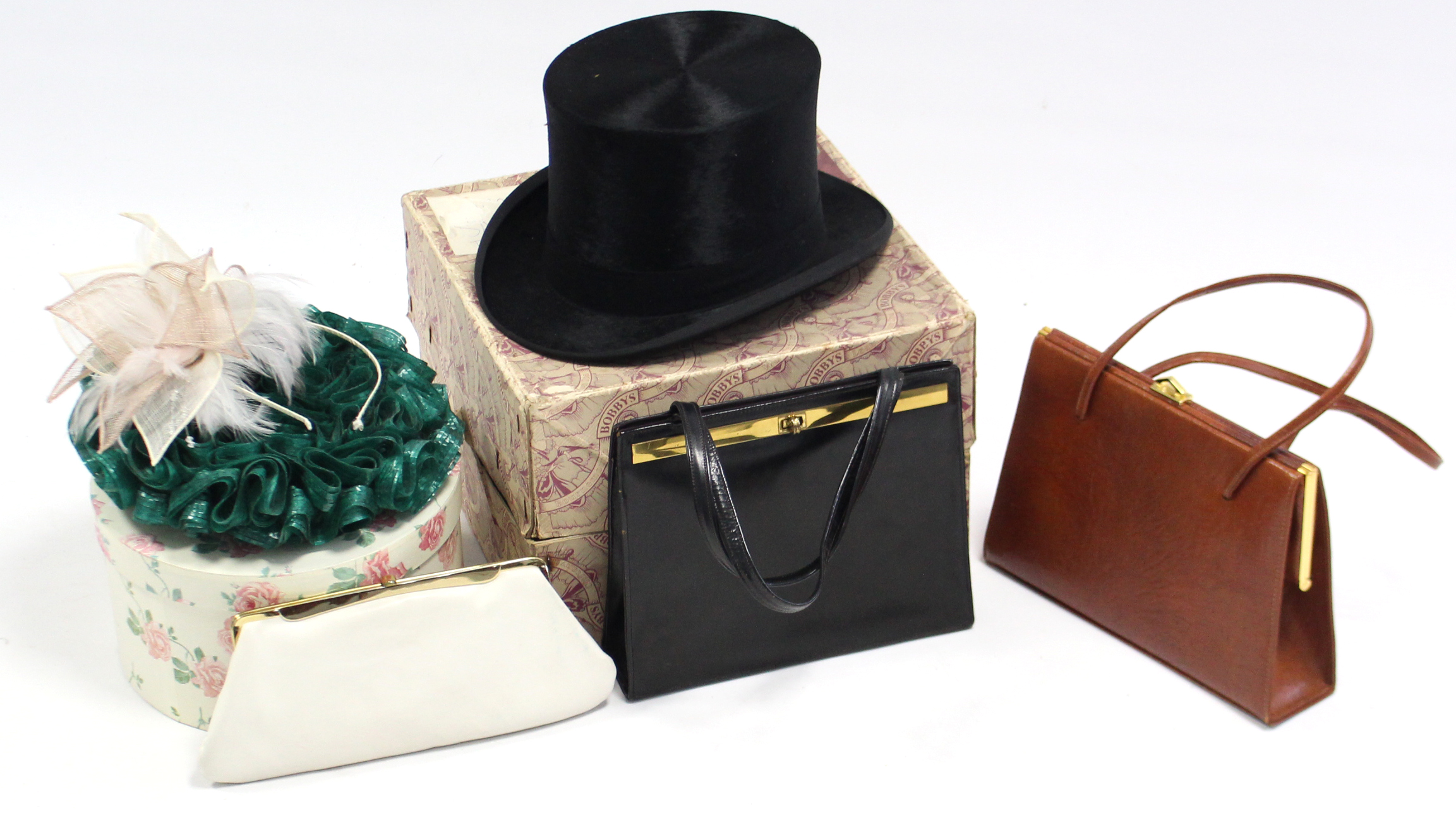 An E. Bissington of 34 Briggate Leeds, black silk top hat with cardboard hat box; together with