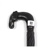 An early 20th century carved ebony gent’s walking cane, with elephant head handle, 35½” long.