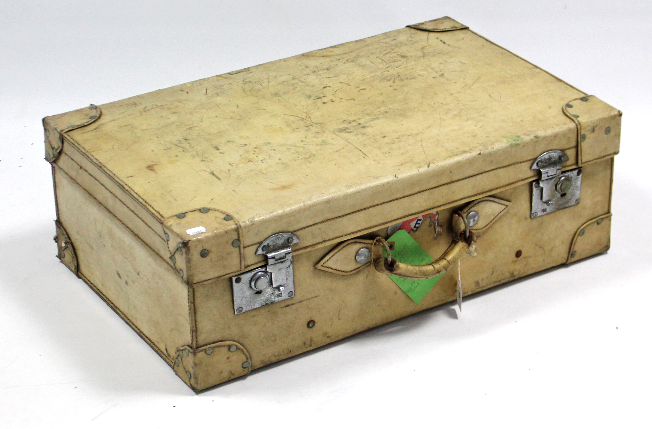 An early-mid 20th century vellum suitcase fitted chrome plated twin-lever locks, 28¼” wide.