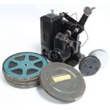 A collection of 16mm film reels; a film projector; & a film editor.