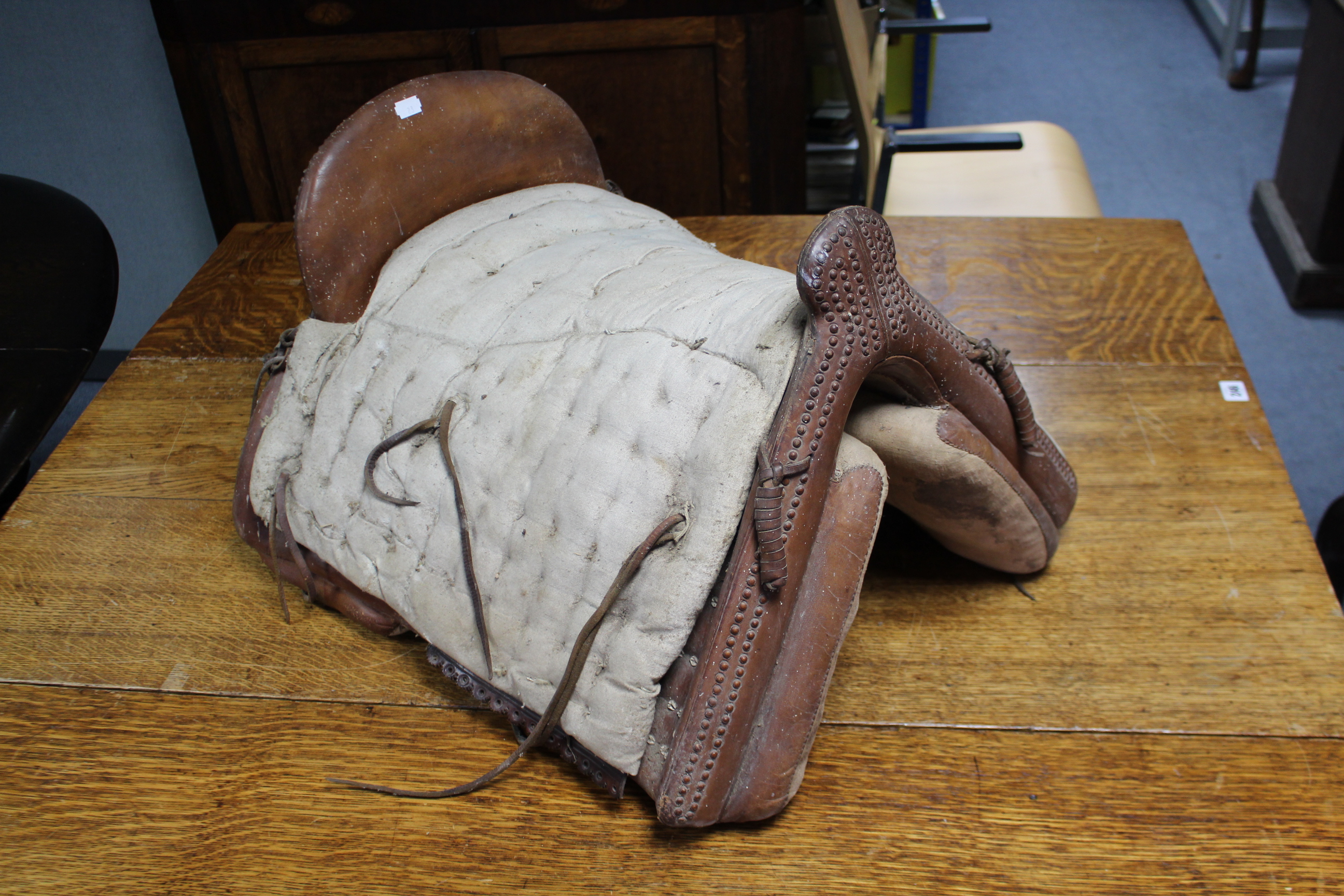 Three leather horse riding saddles; two pairs of riding breeches; a woven horse-hair riding crop; - Image 6 of 23