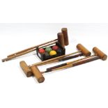 Six various wooden child’s croquet mallets & a set of six croquet balls.