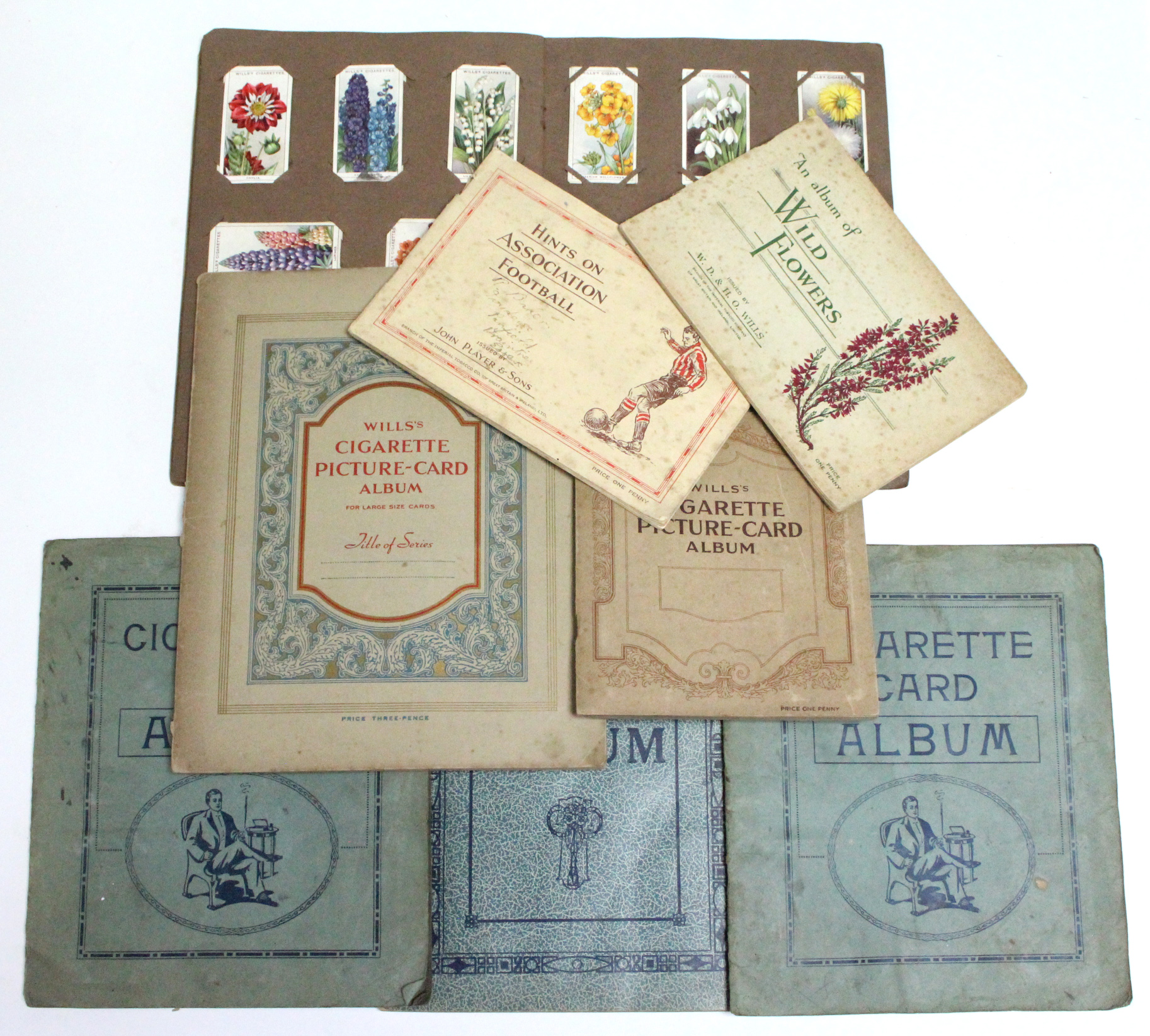 Approximately six hundred various cigarette cards in eight albums, circa 1920’/1930’s.