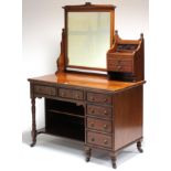 An Edwardian mahogany dressing chest, with swing mirror to the left hand side & two drawers to the