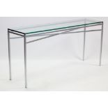 A silvered-metal console table on square legs with shaped stretchers, & with tempered-glass top, 59”