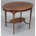 An Edwardian inlaid mahogany occasional table with moulded edge to the oval top, on square tapered