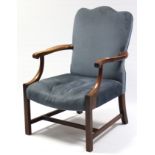 A Georgian-style armchair with padded back & sprung seat upholstered blue velour, & on chamfered
