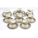 A Paragon china thirty-nine piece tea service (settings for twelve) of white ground & with blue &