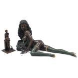 A bronzed ornament in the form of a recumbent nude female figure, 23” long; & a bronzed ballerina