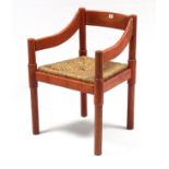 A Habitat bow-back carver chair with woven-rush seat & on round legs.