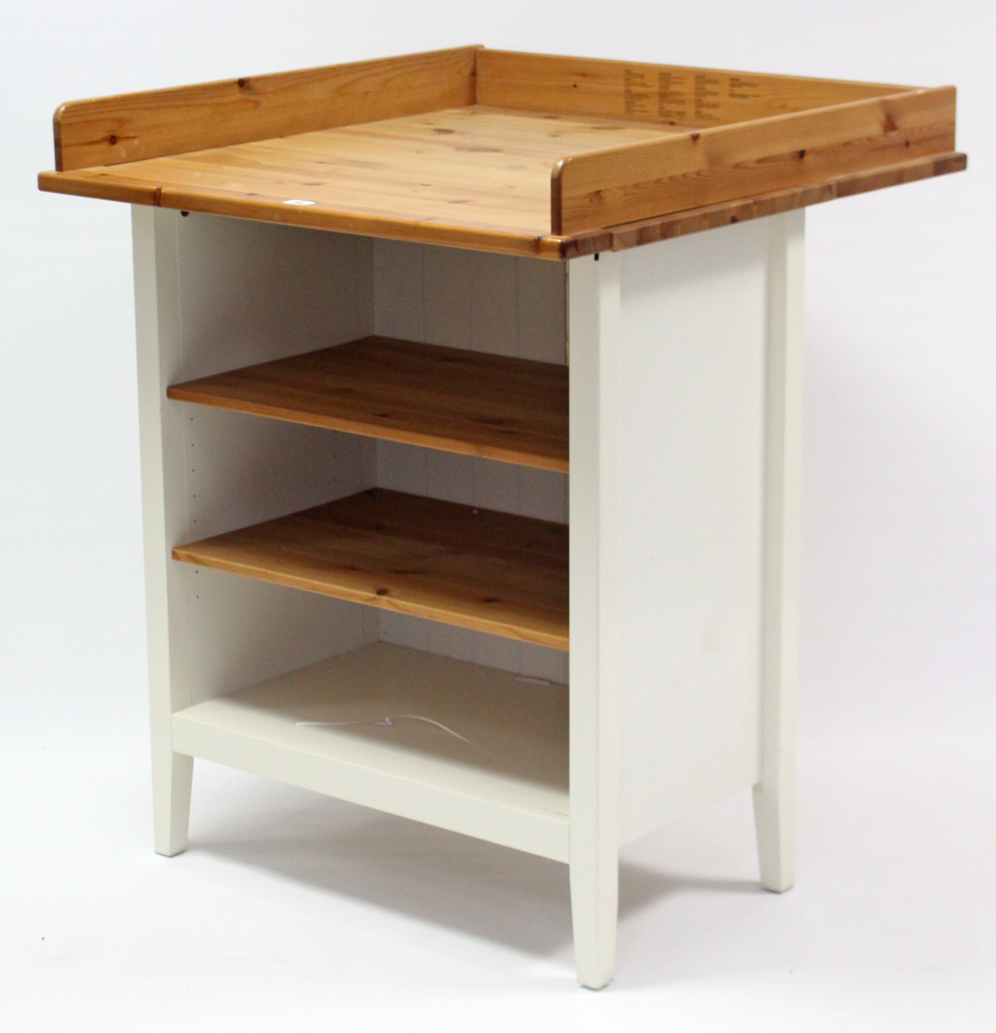 An Ikea pine & white-finish baby changing table with two adjustable shelves below, 31¾” wide x 37”