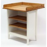 An Ikea pine & white-finish baby changing table with two adjustable shelves below, 31¾” wide x 37”