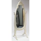 A continental-style white painted carved wooden cheval mirror inset shaped bevelled plate, & on
