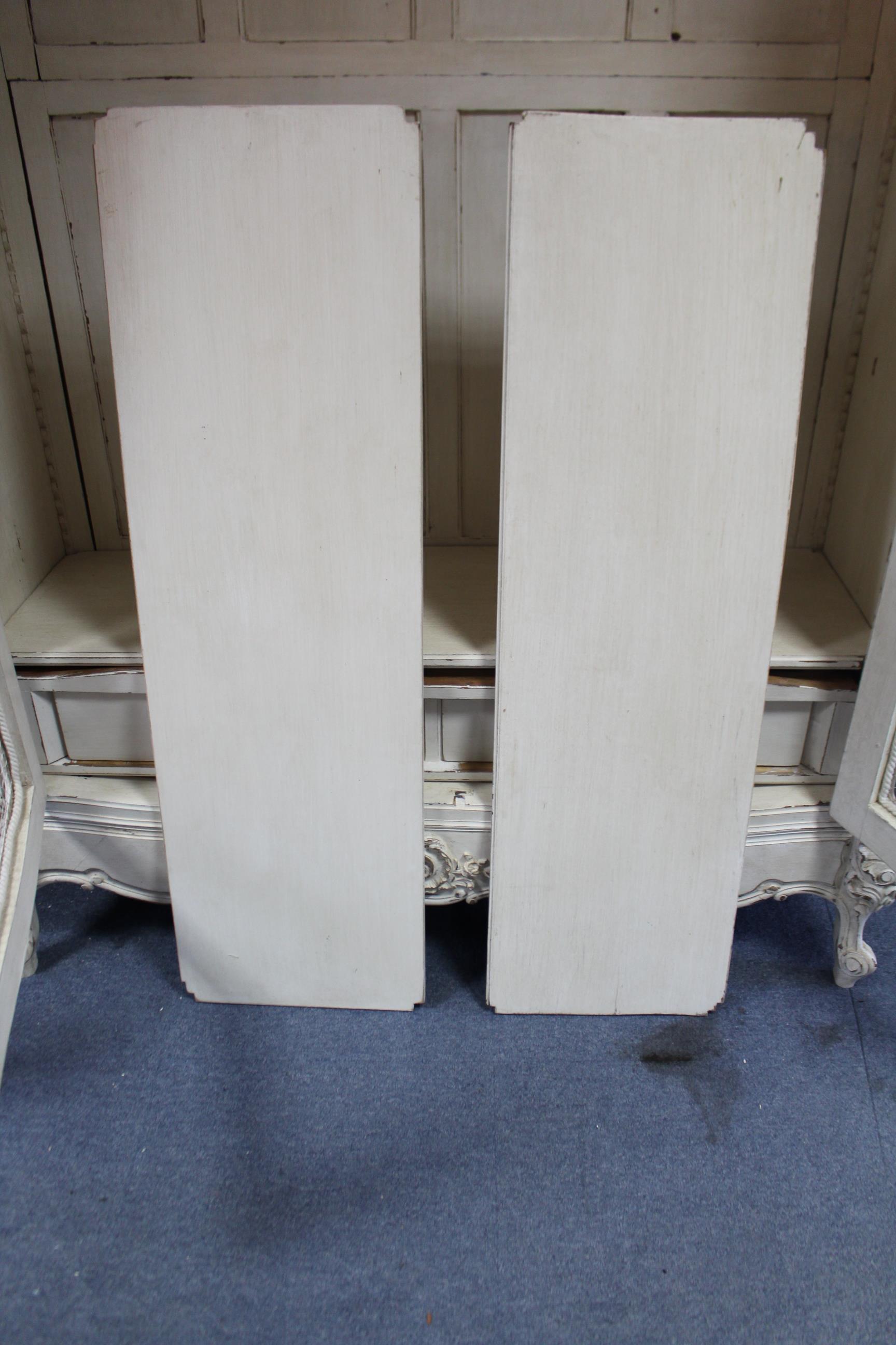 A continental-style white painted & carved wooden wardrobe with shaped cornice, enclosed by pair - Image 6 of 6