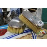 A pair of 1930’s silver-backed clothes brushes, London 1936; together with various items of