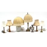 A silver-plated oil table lamp, 14¼” high; & six various table lamps.