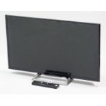 A Sony 31” television with remote control.