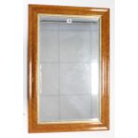 A rectangular wall mirror inset bevelled plate, & in bird’s-eye-maple frame, 34” x 22”.