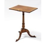 A 19th century mahogany tripod table with rectangular top, & on vase-turned centre column & three