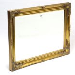 A reproduction gilt frame rectangular wall mirror inset bevelled plate, 26” x 36”.