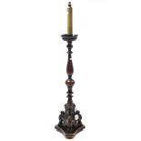 A walnut torchere (converted from a bedpost), with vase-turned centre column & on triform base, 63¾”