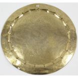 An eastern brass engraved large circular tray, 34¾” diameter.