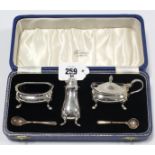 A 1960’s silver three piece condiment set Birmingham 1964, in a fitted “Harrods of London” case.