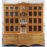 A LARGE PINE GEORGIAN-STYLE DOLL’S HOUSE BY THOMAS ALEXANDER BEITH, “DOLLS HOUSE MAKER OF BATH” (