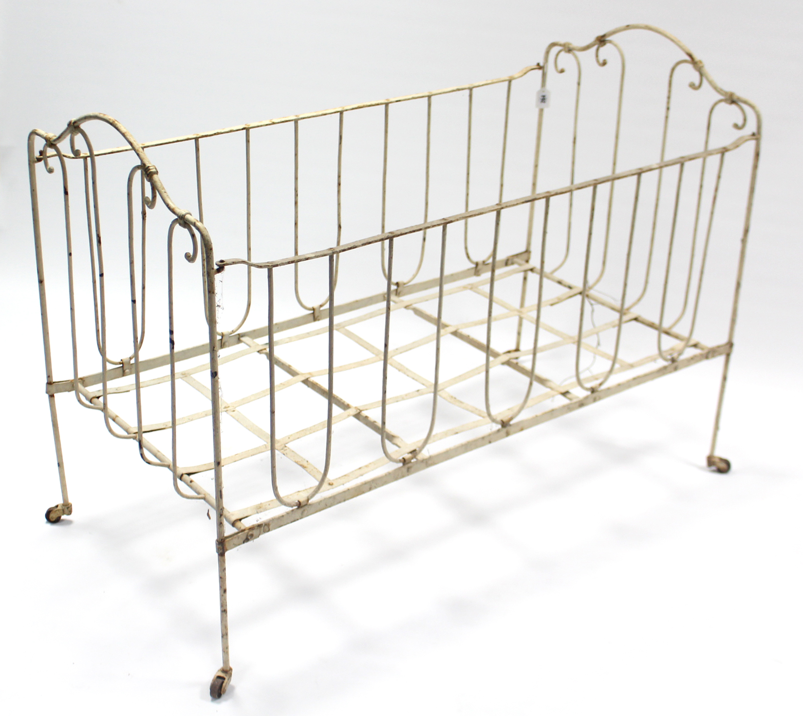 A late 19th/early 20th century white painted wrought-iron folding child’s bed, 45” long. - Image 2 of 2