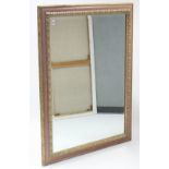 A large gilt & pink painted rectangular wall mirror inset bevelled plate, 37½” x 49½”.