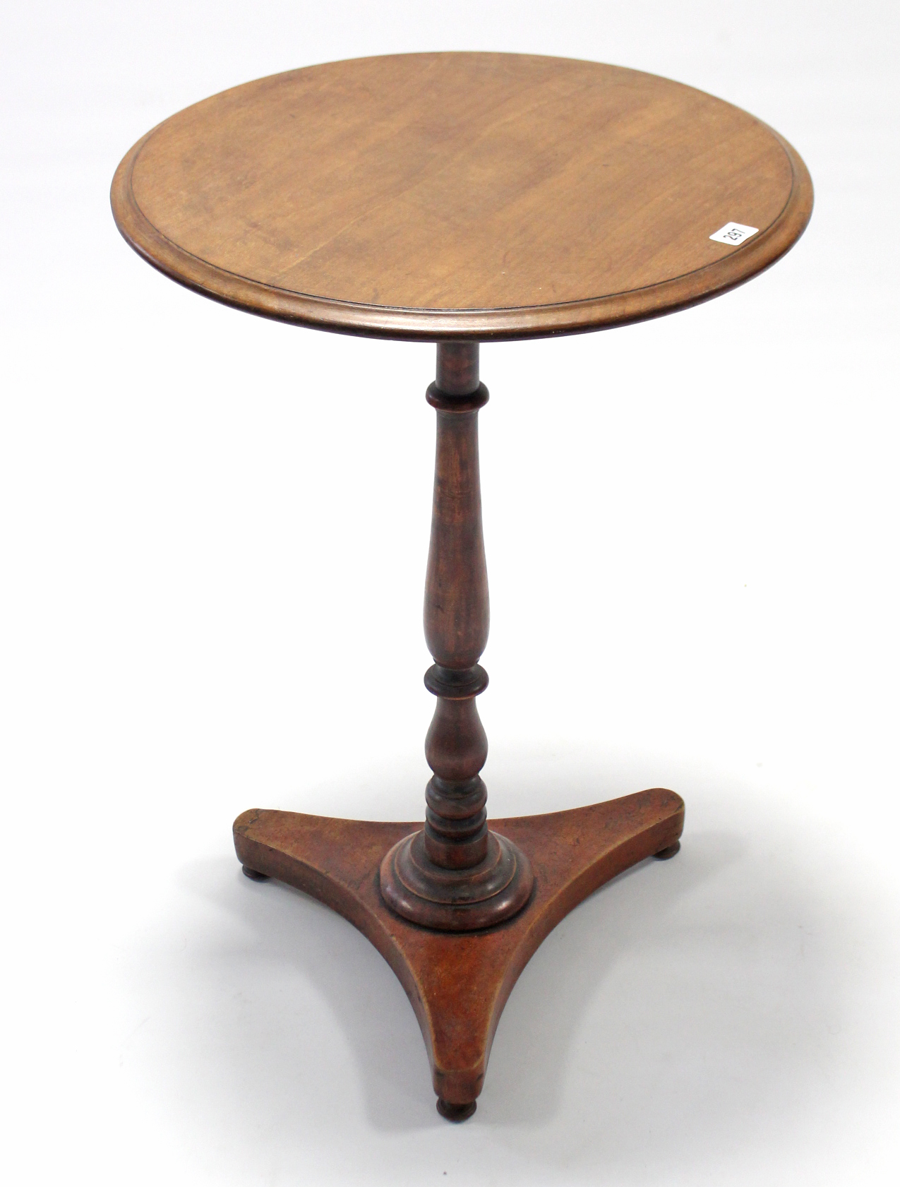 A 19th century mahogany tripod table with circular top, & on vase-turned centre column & triform