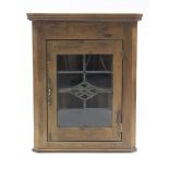 A pine hanging corner cabinet fitted centre shelf enclosed by leaded & stained glass door, 26½