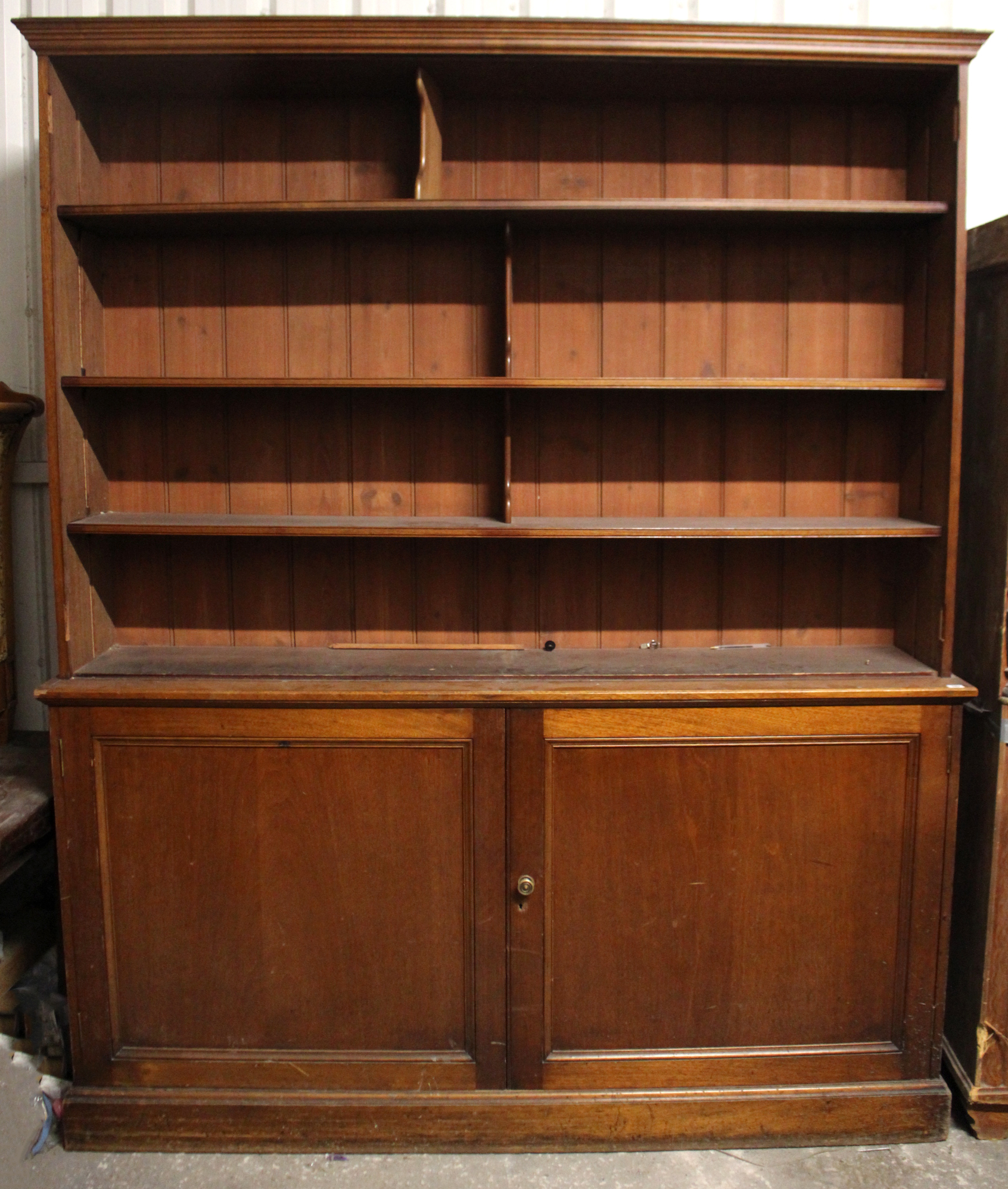 A VICTORIAN MAHOGANY TALL BOOKCASE, the upper part fitted four shelves enclosed by pair of glazed