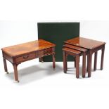 A reproduction mahogany nest of three rectangular occasional tables, each table on four moulded