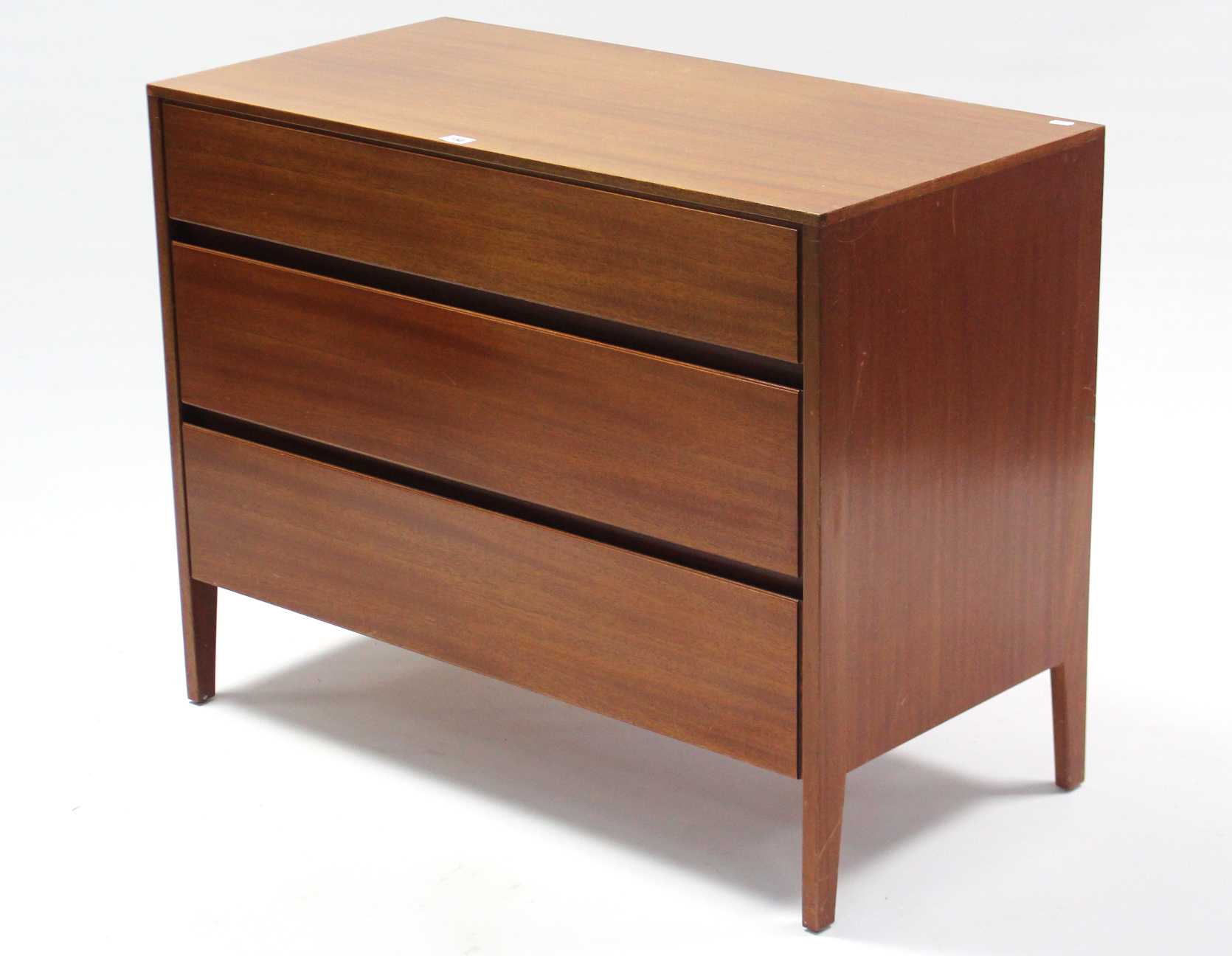 A 1960’s Heals teak low chest fitted three long graduated drawers, 36” wide x 28” high.