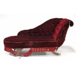 A regency-style chaise longue, upholstered crimson buttoned velour, & on mahogany splay legs with