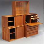 A 1960’s DANISH TEAK MODULAR INTER-CHANGEABLE WALL UNIT DESIGNED BY POUL CADOVIUS, fitted with an