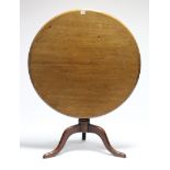 A late 18th/early 19th century mahogany tripod table, the circular top with moulded edge, on