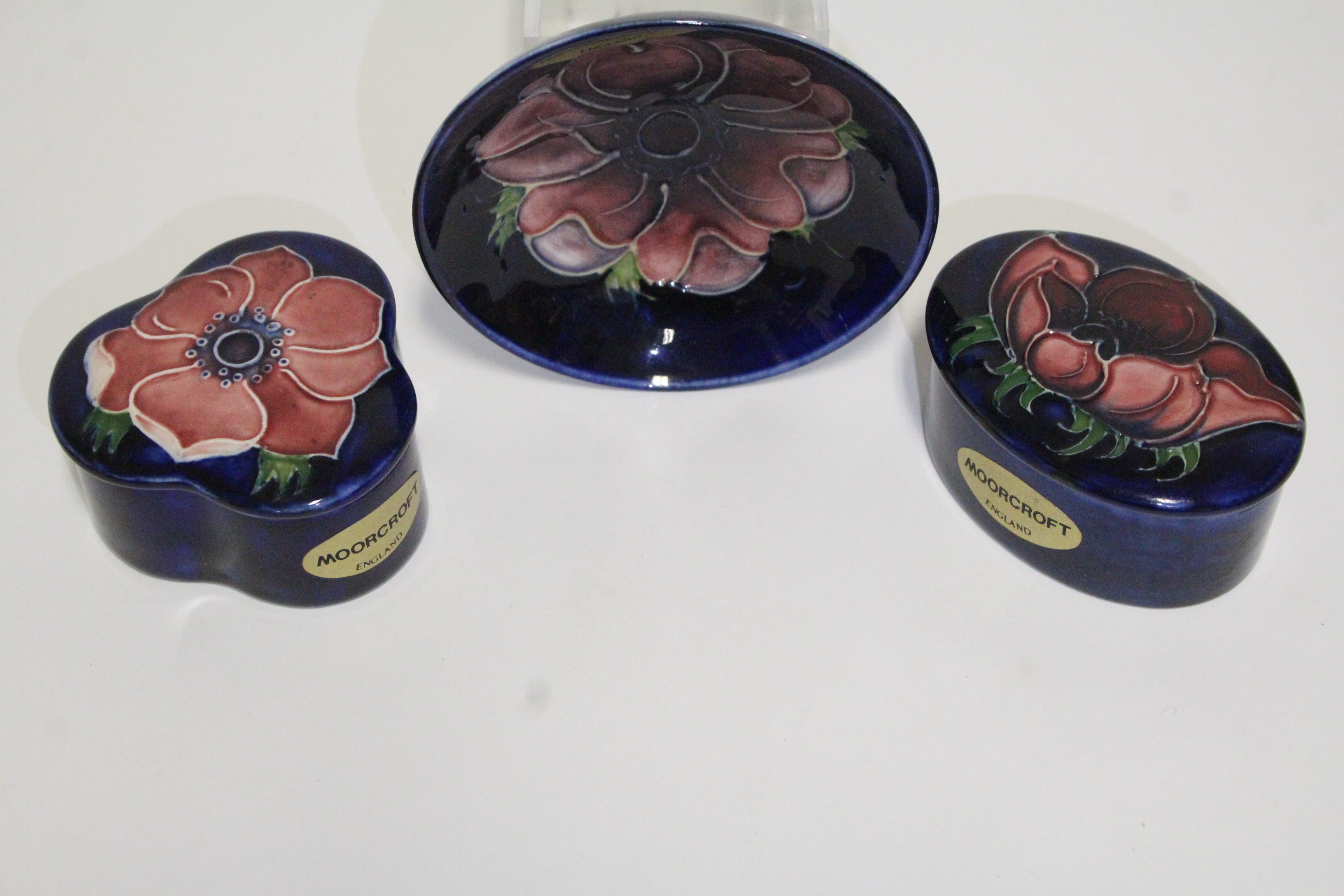 A Moorcroft “Anemone” small trefoil-shaped box & cover, 2¾” wide; an oval ditto, 3”; & a ditto - Image 2 of 2