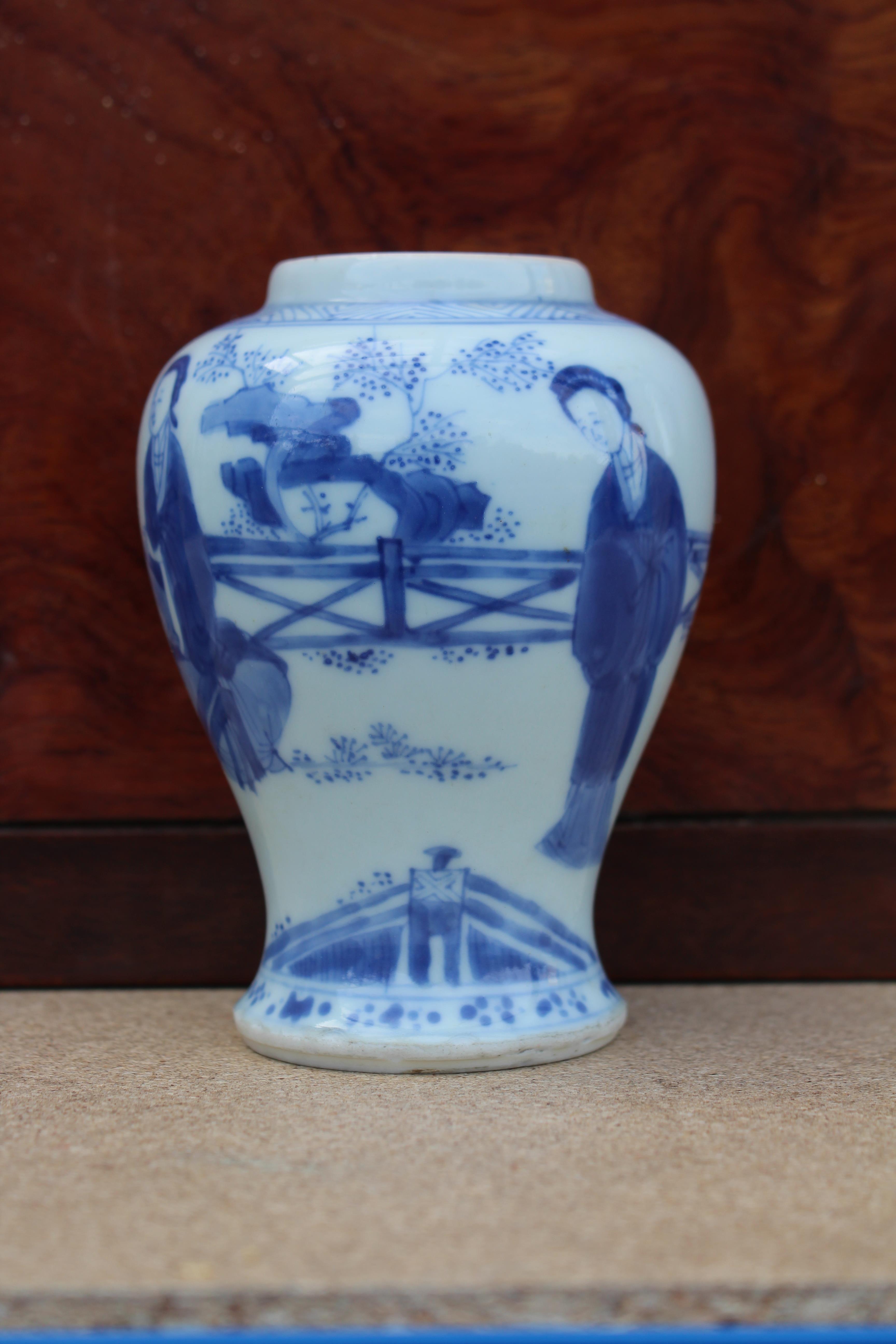 A Chinese Kangxi period blue & white porcelain small baluster vase painted with ladies in a formal - Image 5 of 11