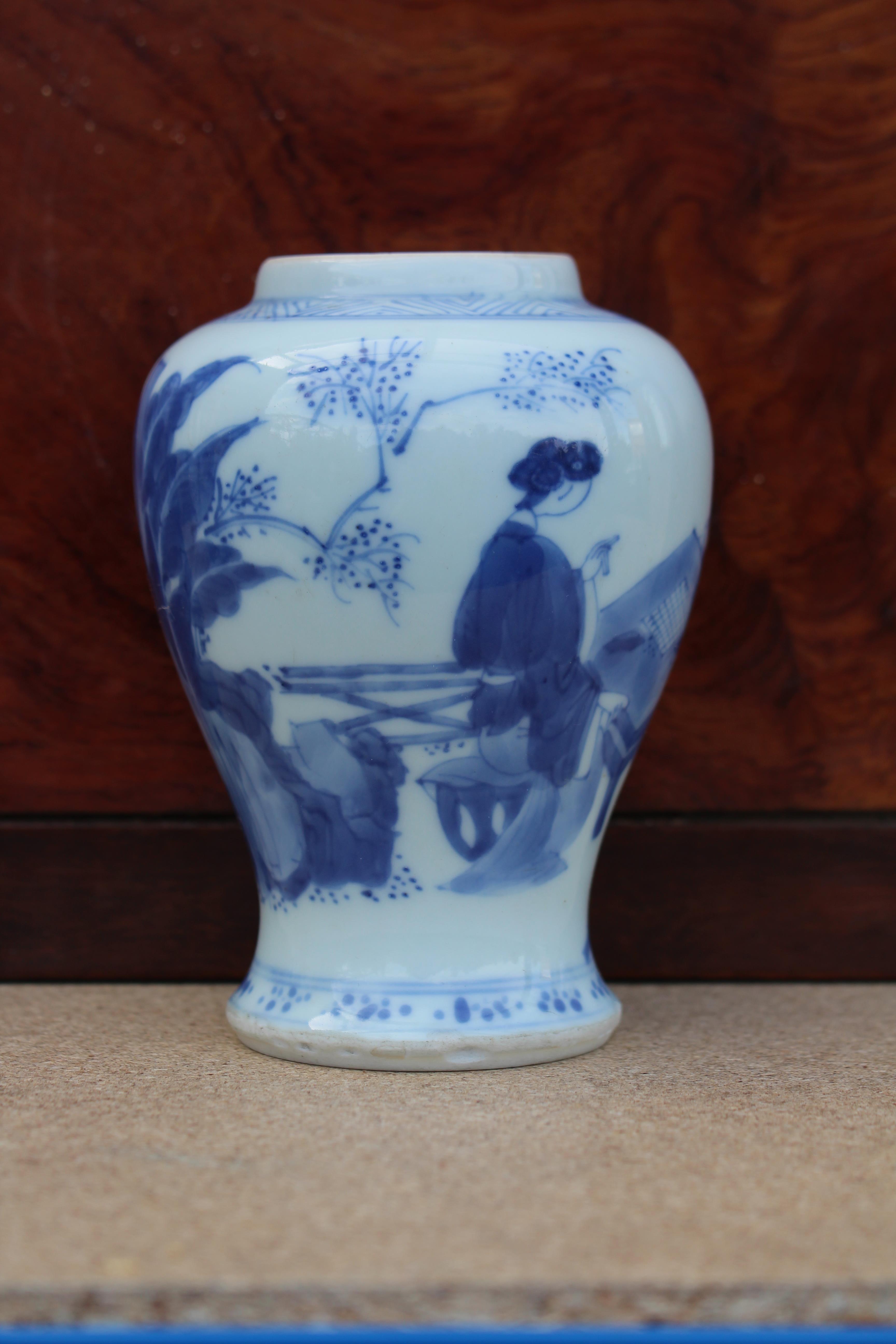 A Chinese Kangxi period blue & white porcelain small baluster vase painted with ladies in a formal - Image 3 of 11