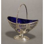 A modern silver pierced oval sugar basin in the late 18th century style, with beaded rim, swing