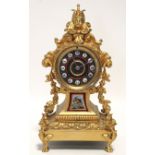 A 19th century French mantel clock in gilt speltre rococo style case inset porcelain plaque, the